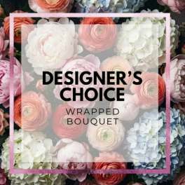 Wrapped bouquet with pastel flowers and bold text overlay