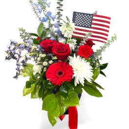 Red, white, and blue floral bouquet with an American flag