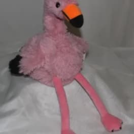 Pink plush flamingo toy with an orange-and-black beak