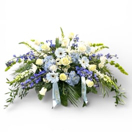 Large blue and white floral spray with ribbons