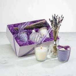 Lavender gift set with candles, perfume bottles, and dried lavender in a box
