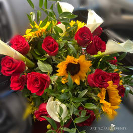 Bouquet of red roses, sunflowers, and white calla lilies