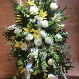Tall white and yellow floral spray with roses and lilies