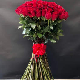 Large bouquet of red roses tied with a red ribbon