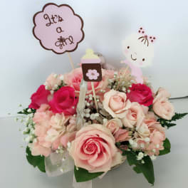 Pink and cream rose bouquet with baby’s breath and cute topper signs