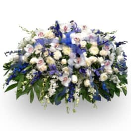 Large white and blue floral spray with orchids and lilies