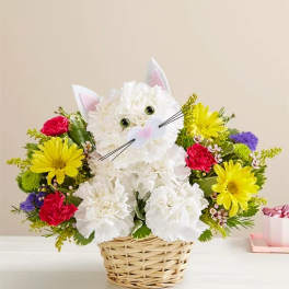 Cat-shaped flower basket with white and colorful blooms
