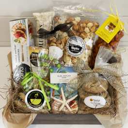 Gift basket with assorted packaged snacks and cookies tied with ribbons