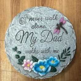 Round painted stone with the words "My Dad" and small flowers