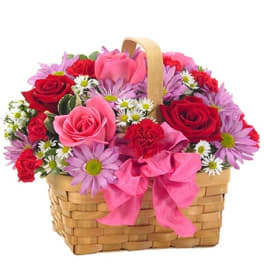 Basket of pink and red roses with purple daisies and a pink bow