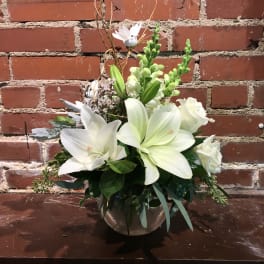 White lily and rose arrangement in a silver vase
