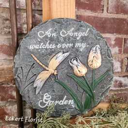 Round memorial plaque with a dragonfly and tulips, reading "An Angel watches over my Garden"