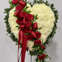 Heart-shaped floral spray with red roses and white chrysanthemums