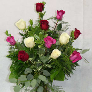 Mixed roses in red, pink, and white in a glass vase