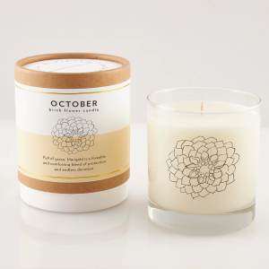 Two October birth flower candles, one in a box and one in a glass jar