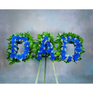 Blue rose floral tribute spelling "DAD" on an easel