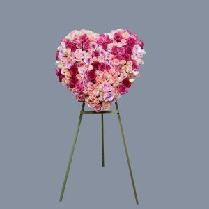 Heart-shaped rose arrangement on an easel
