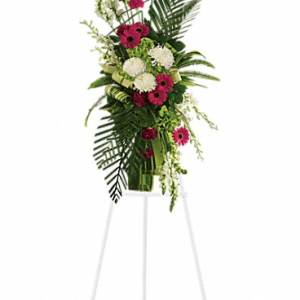Tall floral spray with pink and white blooms on a stand