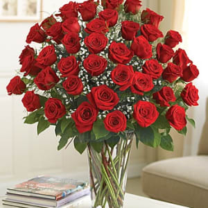 Bouquet of red roses in a clear glass vase