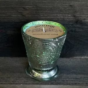Scented candle in a textured glass holder