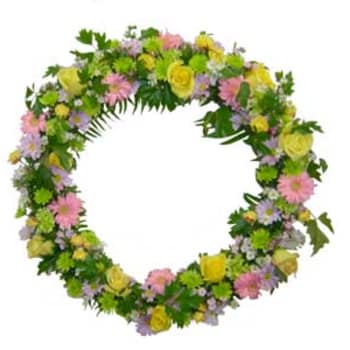 Circular floral wreath with pink, yellow, and lavender flowers