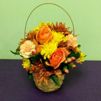 Basket arrangement with orange roses and yellow chrysanthemums