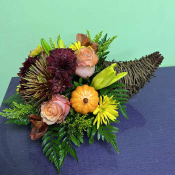 Bouquet with roses, chrysanthemums, and a small pumpkin accent