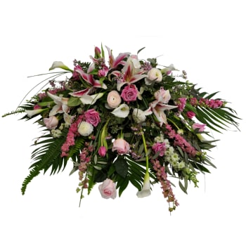 Large pink and white floral spray with lilies, roses, and calla lilies