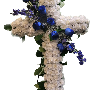Cross-shaped floral arrangement with white carnations and blue roses