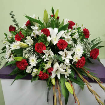 Large red and white floral spray with lilies and carnations