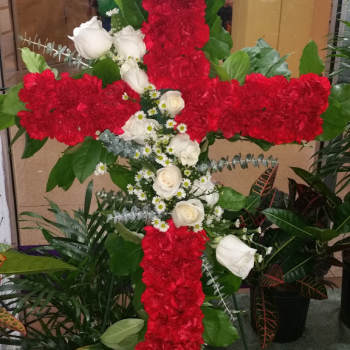 Red and white floral cross arrangement with roses