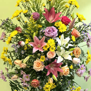 Large mixed bouquet with lilies, roses, and yellow daisies