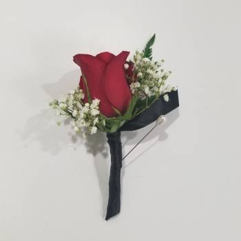 Red rose boutonniere with white baby's breath and black ribbon