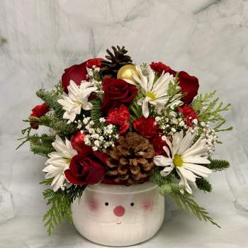 Holiday bouquet in a Santa face container with red roses and white daisies