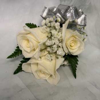Cream roses with baby's breath and a silver bow