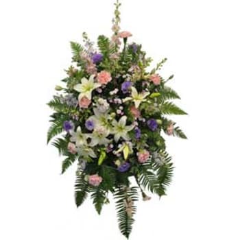 Standing floral spray with white lilies, pink and purple blooms