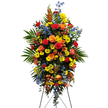 Tall standing spray of mixed colorful flowers on an easel