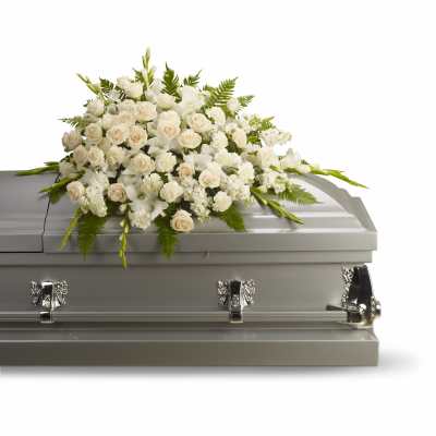 White floral spray on a gray casket