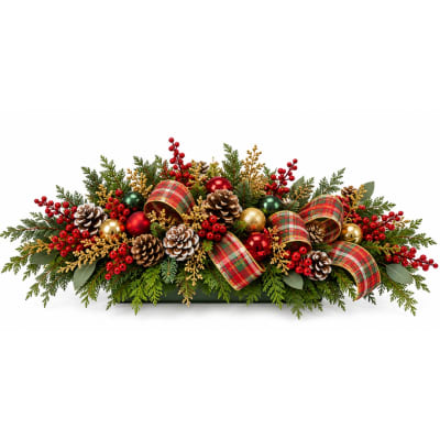 Christmas centerpiece with pinecones, berries, and plaid ribbon