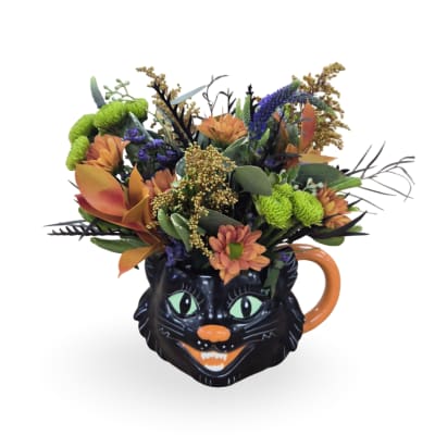 Bouquet in a black cat mug with orange and green flowers
