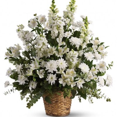 White floral arrangement in a woven basket