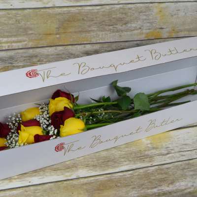 Boxed bouquet of red and yellow roses