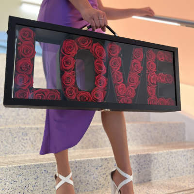 Framed rose arrangement spelling LOVE
