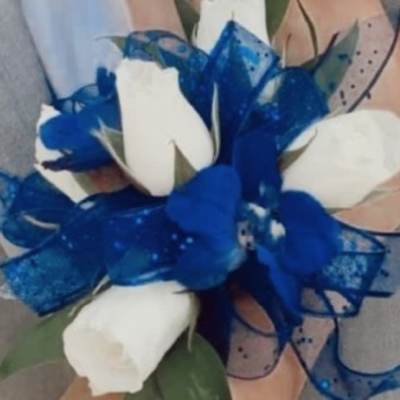 White roses with a blue ribbon bow