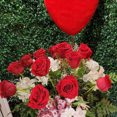 Red roses with white flowers and a heart balloon