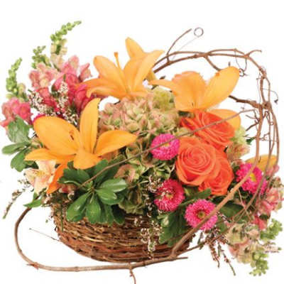 Basket arrangement with orange lilies and pink flowers