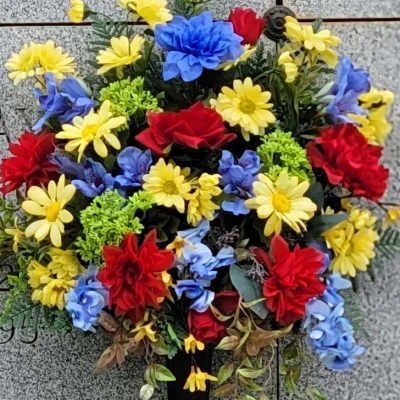 Colorful bouquet of red, yellow, and blue flowers