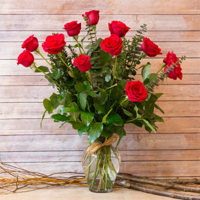 Bouquet of red roses in a clear glass vase