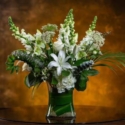 White floral arrangement in a clear glass vase
