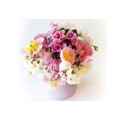 Pink and white mixed bouquet in a lavender round box